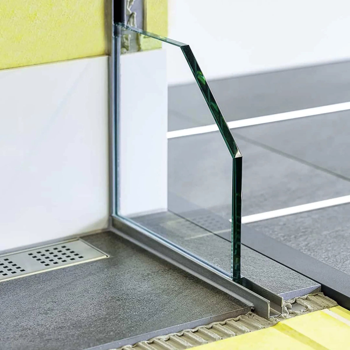 Lifestyle image of a walk-in shower with slope wedge for glass holder