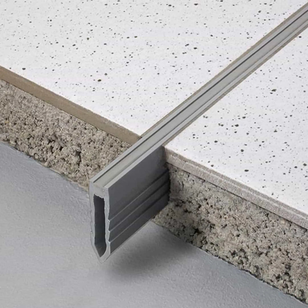 Lifestyle image expansion joint profile made of PVC for thick-bed installation fitted between 2 tiles