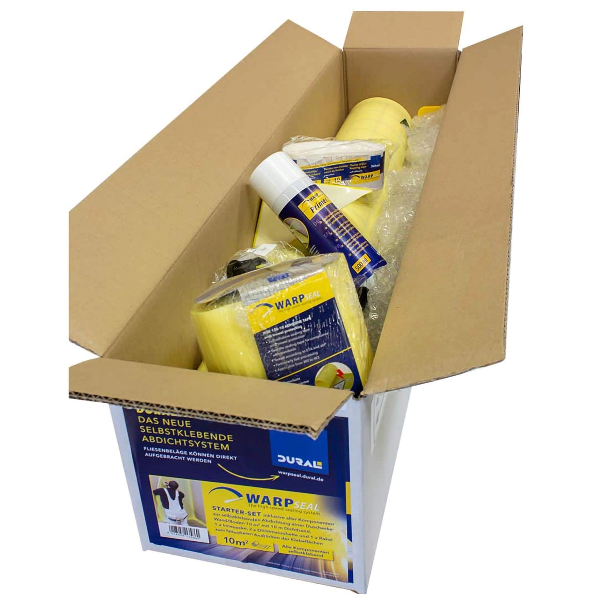 Starter kit of the self-adhesive waterproofing in a long cardboard box. Contents include sealing tape, primer, waterproofing membrane, corners and more