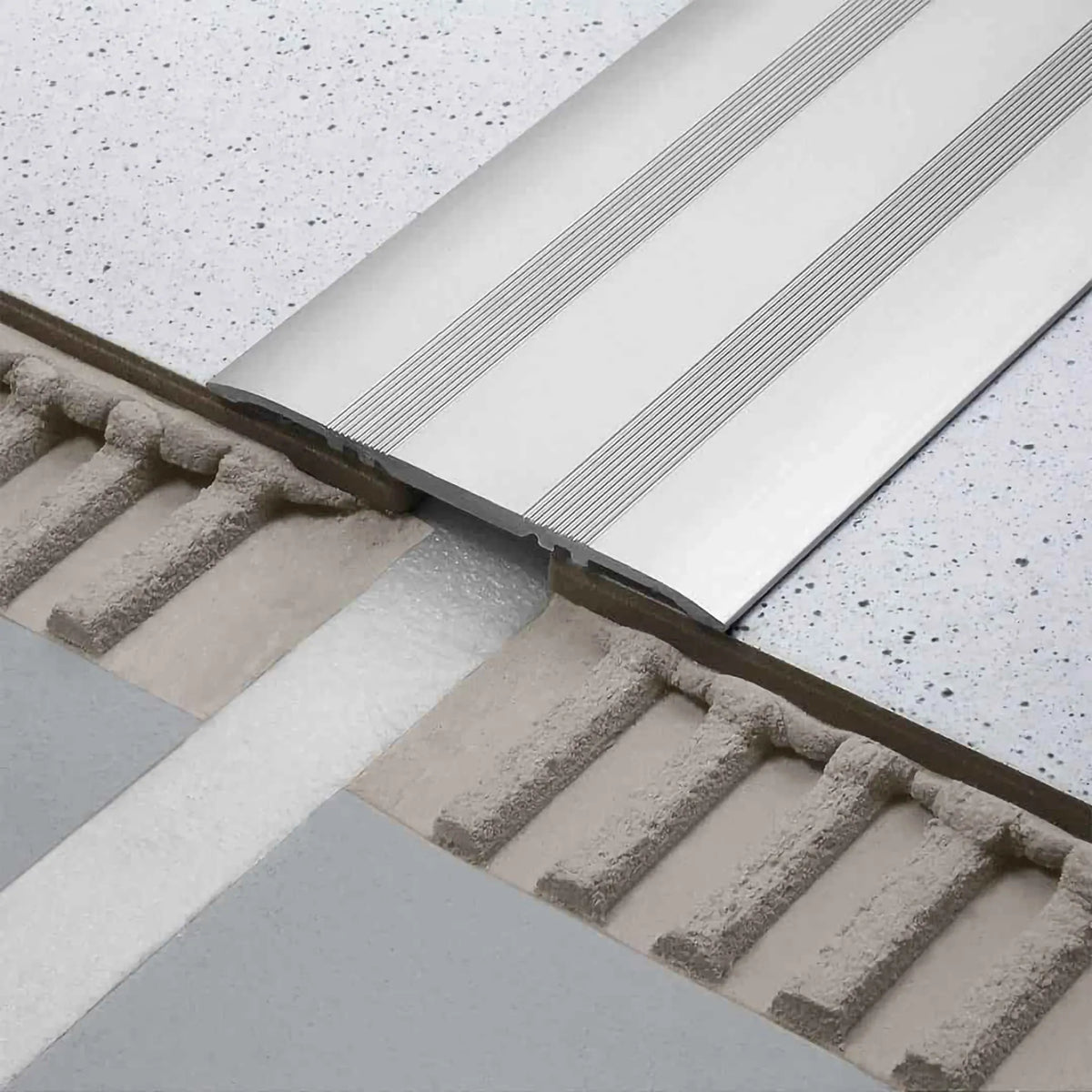 Cover profile aluminium in 80mm width installed over 2 tiles as a transition
#A0002922
#A0002926
#A0002930
#A0002934
