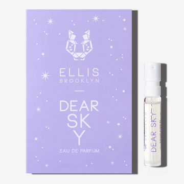 Dear Sky 1.5ml Eau De Parfum Vial next to purple Dear Sky Eau De Parfum vial holder card. | english_image