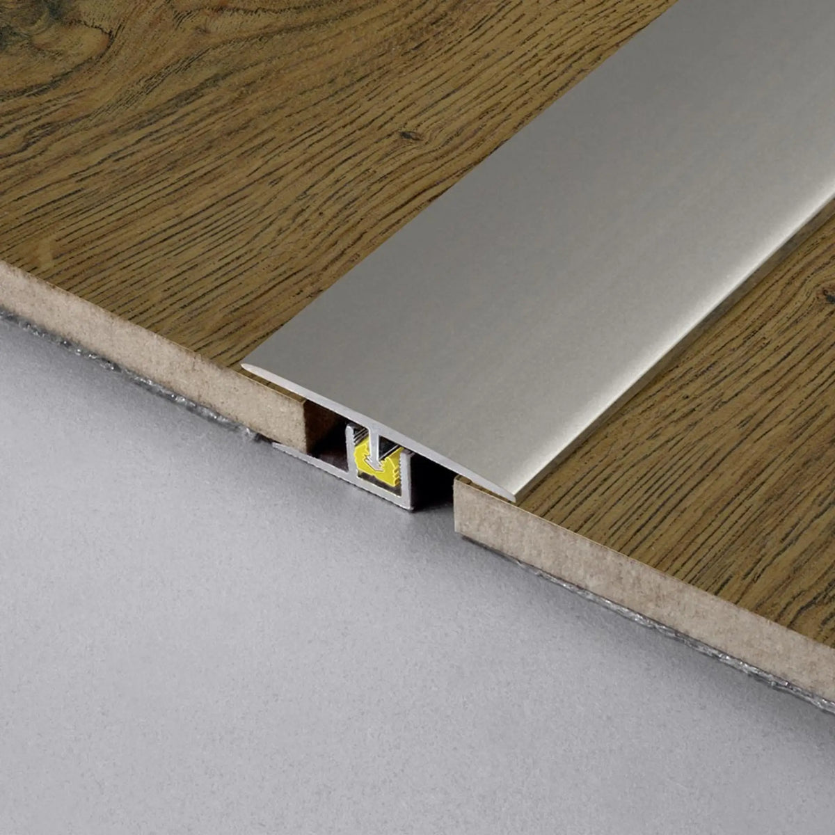 DURAL transition profile CLIPPER titanium installed between parquet flooring