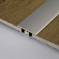 DURAL transition profile CLIPPER titanium installed between parquet flooring