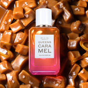 Queens Caramel 50ml Eau De Parfum on cubes of caramel, melted caramel, and pink salt.