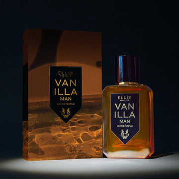 Vanillla Man 50ml Eau De Parfum next to Vanilla Man Eau De Parufm box in spotlight, on black background.