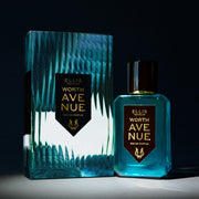 Worth Avenue 50ml Eau De Parfum next to Worth Avenue Eau De Parufm box in spotlight, on black background.